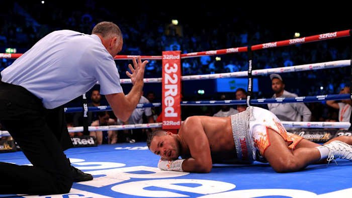 Joe Joyce lies on the floor following a punch from Zhilei Zhang during the WBO Interim World Heavyweight Title fight between Zhilei Zhang and Joe Joyce at OVO Arena Wembley on September 23, 2023 in London, England. STEPHEN POND/GETTY IMAGES.